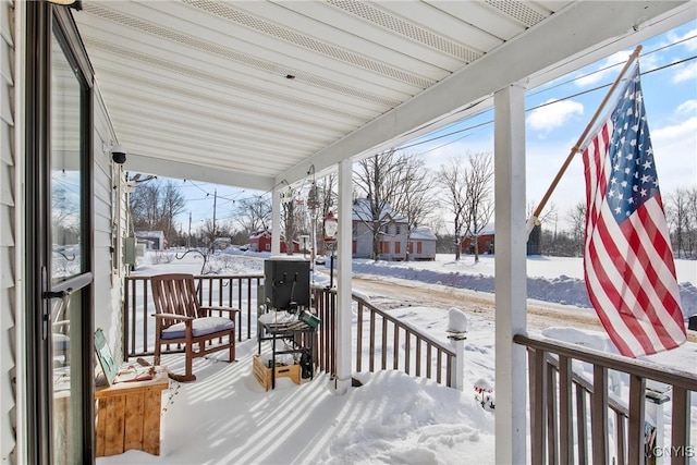 view of snow covered deck