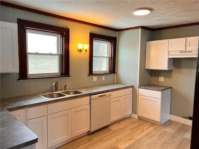 kitchen featuring dishwasher, light wood finished floors, a sink, and white cabinets