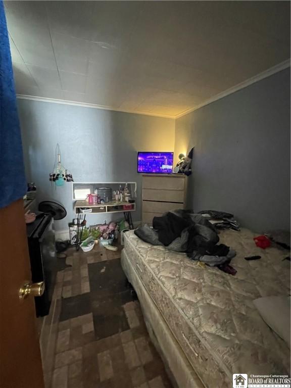 bedroom with ornamental molding