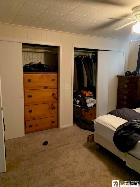 bedroom with carpet, a closet, and ceiling fan