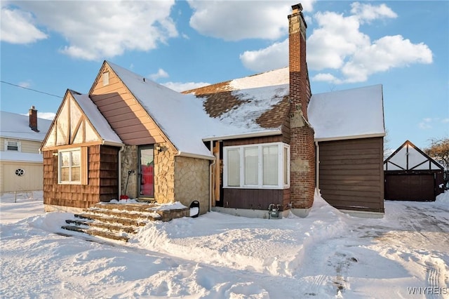 view of front of house featuring a chimney