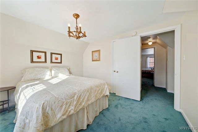 carpeted bedroom with lofted ceiling, baseboards, and a notable chandelier