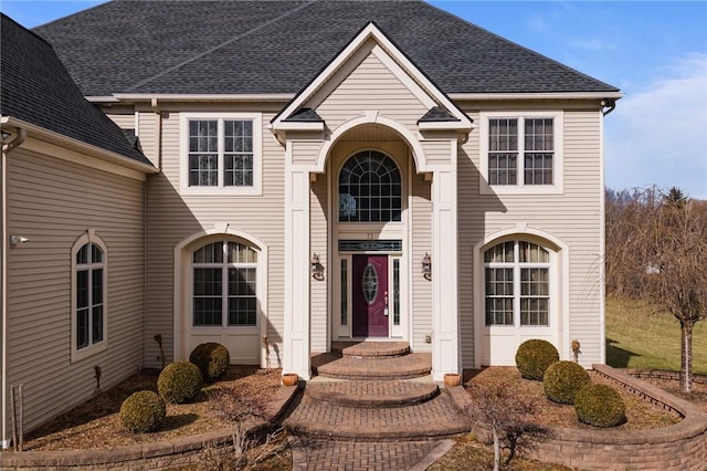 traditional-style home with a shingled roof