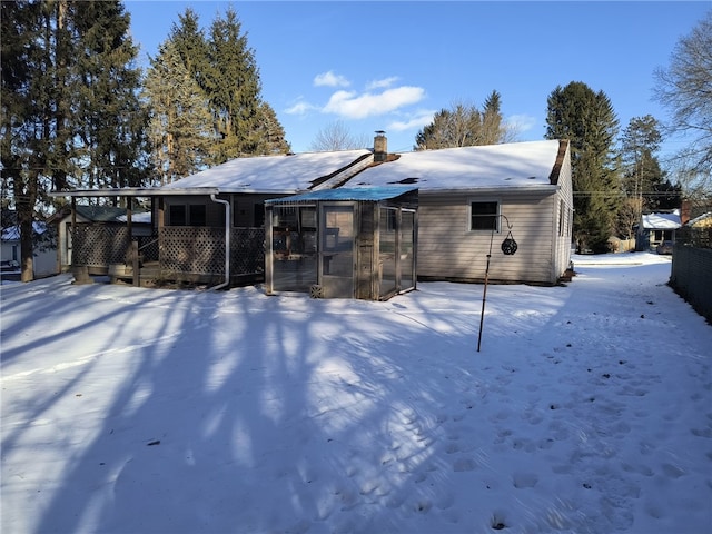 view of snow covered house