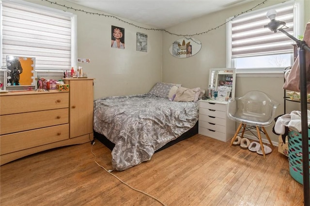 bedroom featuring light wood-style flooring