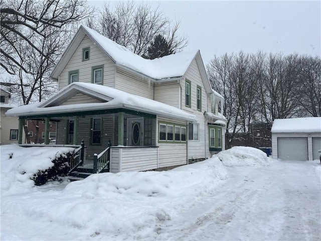 view of front of house with a porch, an outdoor structure, and a garage