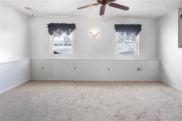 unfurnished room featuring carpet floors and ceiling fan