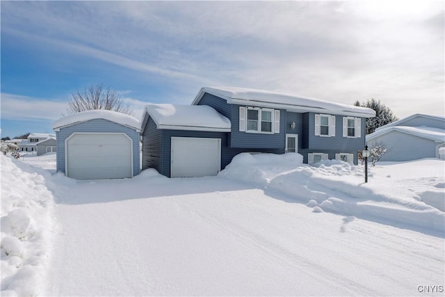 view of front of home with a detached garage