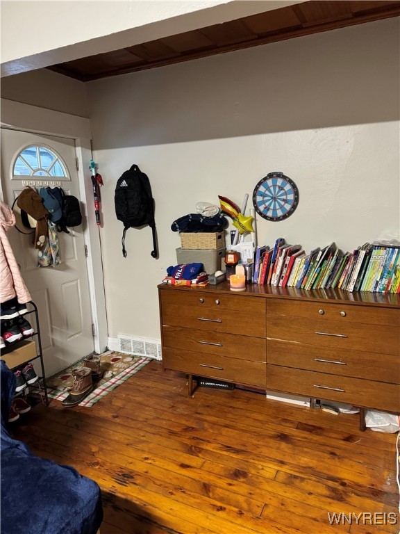 entryway with visible vents and dark wood-style flooring