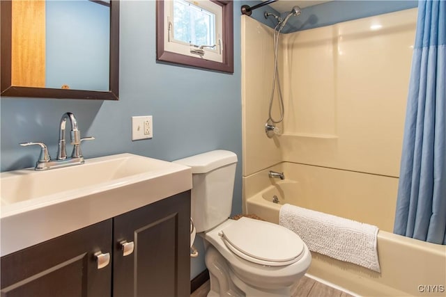 32702 Old Town Springs Rd, Clayton, NY 13622 - full bathroom featuring toilet, shower / bathtub combination with curtain, and vanity