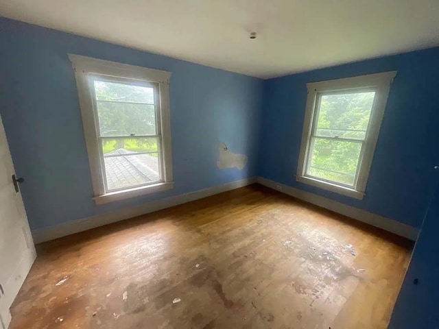 empty room featuring baseboards