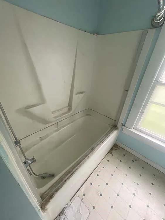 bathroom with  shower combination and tile patterned floors