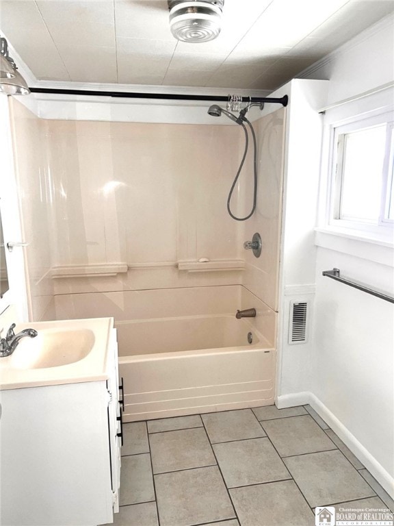 full bath with visible vents, baseboards, bathing tub / shower combination, tile patterned flooring, and vanity