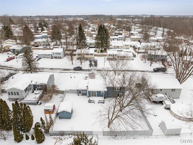 snowy aerial view with a residential view