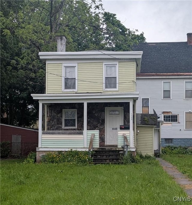 1509 Sunset Ave, Utica, NY 13502 - view of front of house with a chimney, a front yard, covered porch, and stone siding