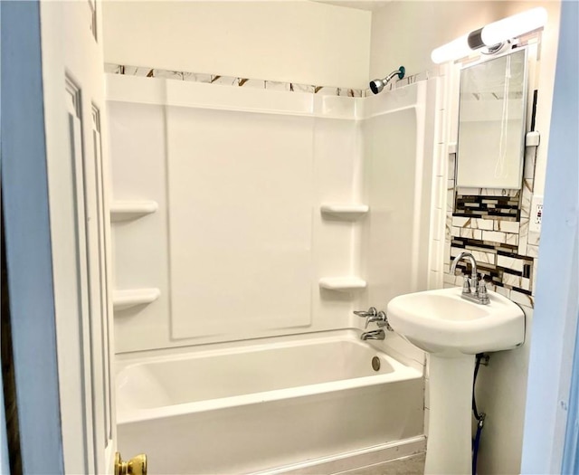 full bathroom featuring decorative backsplash and shower / tub combination