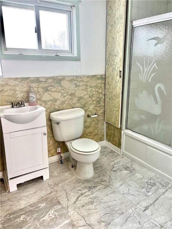 bathroom with enclosed tub / shower combo, marble finish floor, toilet, and vanity