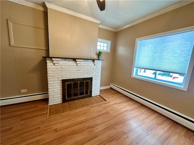 unfurnished living room featuring a baseboard radiator, ornamental molding, baseboard heating, and light wood-style flooring