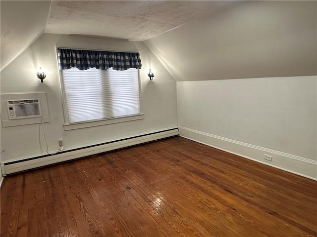 bonus room with a baseboard radiator, vaulted ceiling, a textured ceiling, wood finished floors, and a wall mounted air conditioner