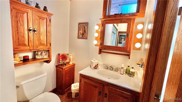 6539 Plum Creek Rd, Mansfield, NY 14731 - bathroom featuring vanity, toilet, and tile patterned flooring