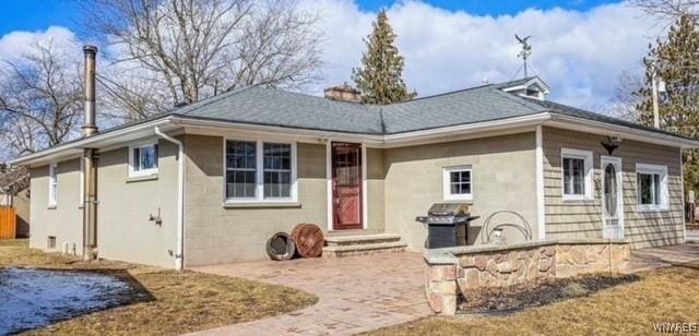 view of front of home featuring entry steps and a patio area