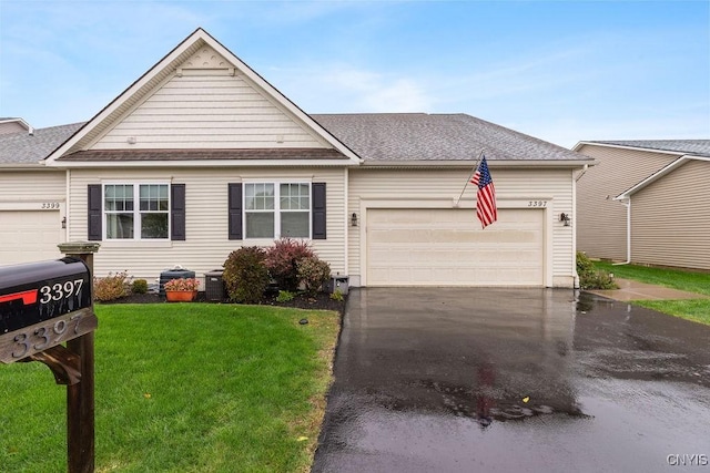 view of front facade featuring central AC unit, aphalt driveway, a garage, roof with shingles, and a front lawn