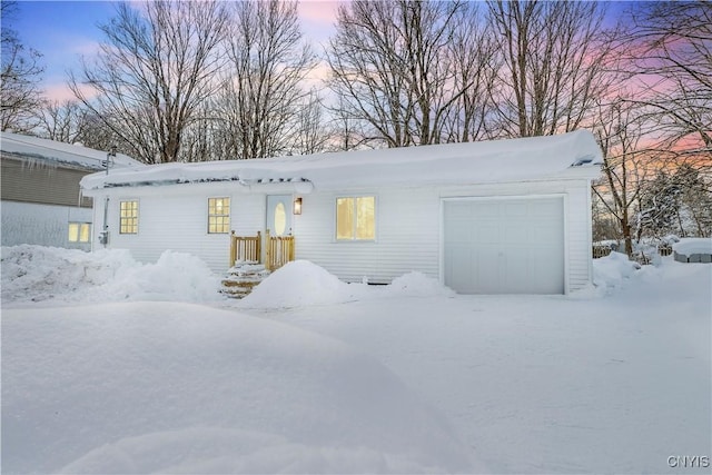 view of front of property with a garage