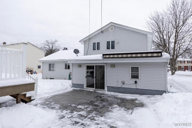 view of snow covered house