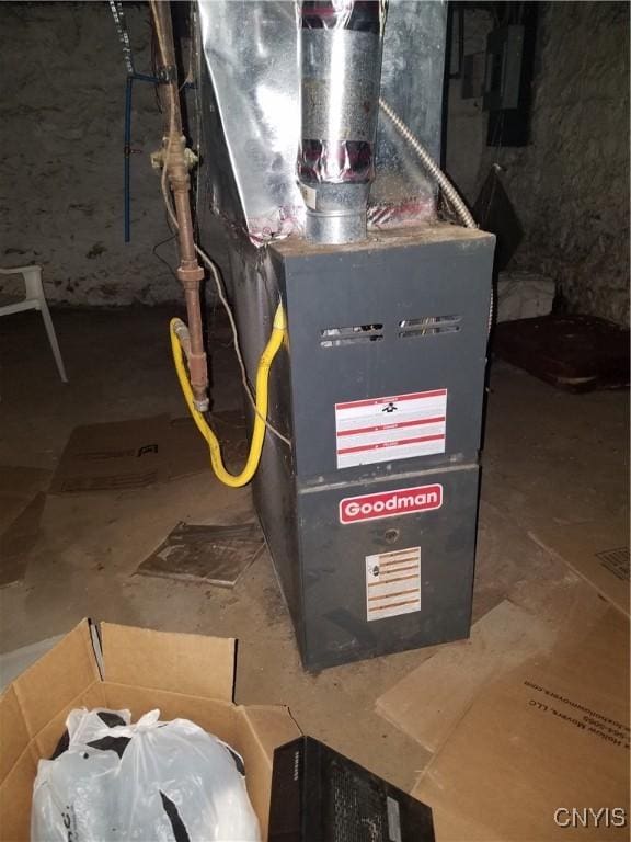 utility room featuring heating unit