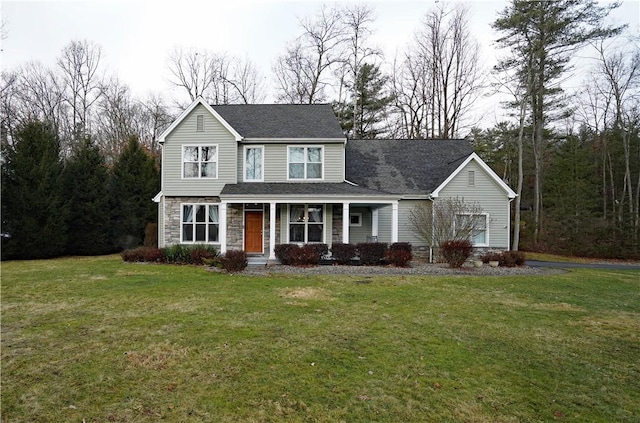 traditional-style home featuring a shingled roof, stone siding, covered porch, and a front lawn