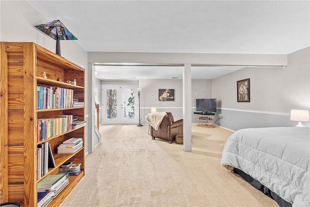 bedroom featuring carpet and access to outside