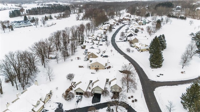 snowy aerial view featuring a residential view