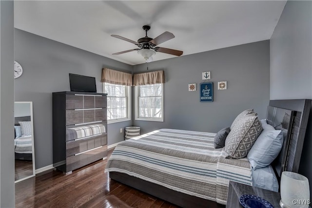 bedroom featuring dark wood finished floors, baseboards, and ceiling fan