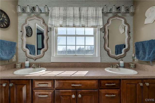 full bathroom with double vanity and a sink