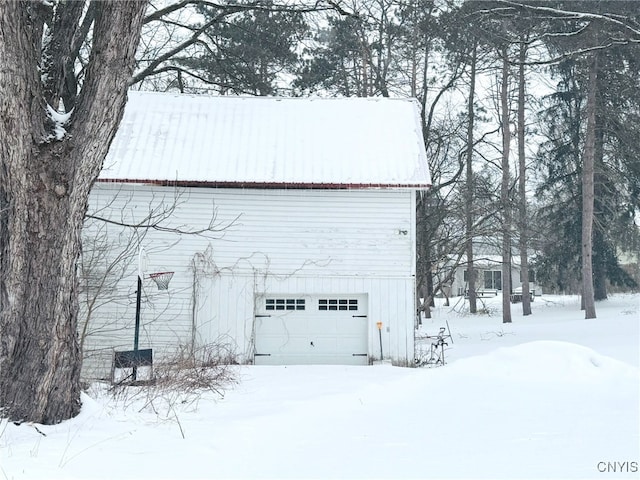 view of snow covered garage