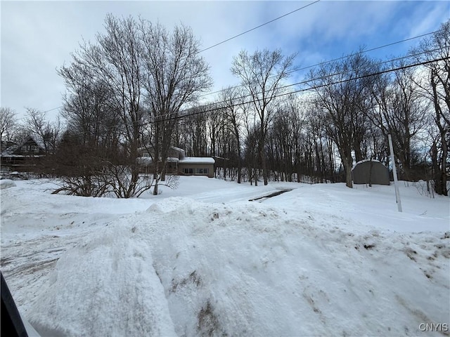 view of yard layered in snow