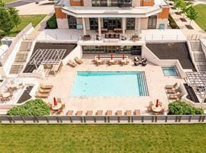 rear view of house featuring a patio and a community pool