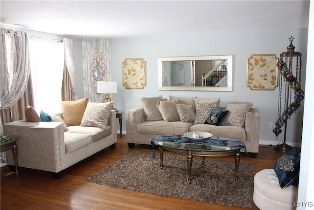 living room with dark wood-style floors and baseboards