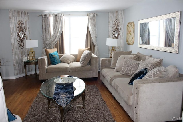 living area featuring dark wood finished floors and baseboards