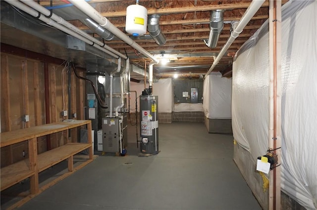 unfinished below grade area featuring water heater