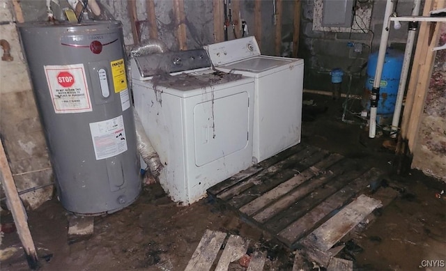 washroom featuring water heater, laundry area, and washing machine and clothes dryer