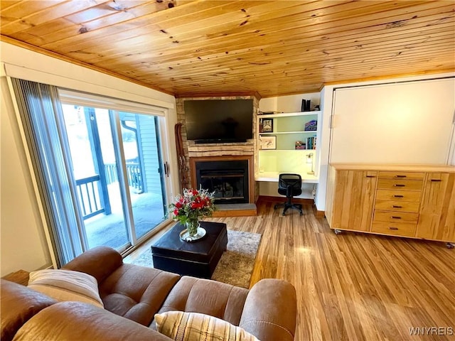 living room with light wood-style floors, wood ceiling, a fireplace with raised hearth, and built in desk