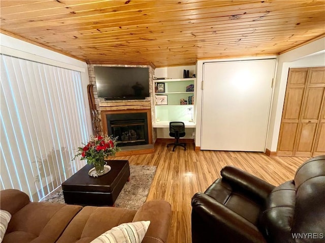 living room featuring wooden ceiling, light wood-style flooring, and a fireplace with raised hearth