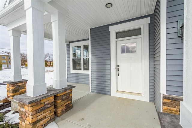 doorway to property featuring a porch