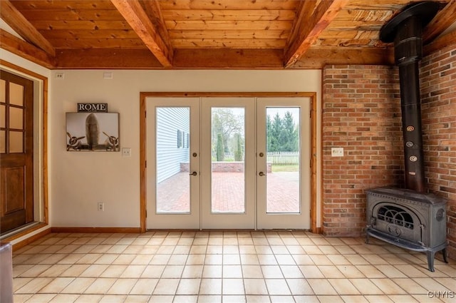 doorway to outside featuring french doors, light tile patterned floors, lofted ceiling with beams, wood ceiling, and a wood stove