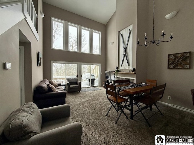 dining room featuring carpet floors, high vaulted ceiling, and a notable chandelier