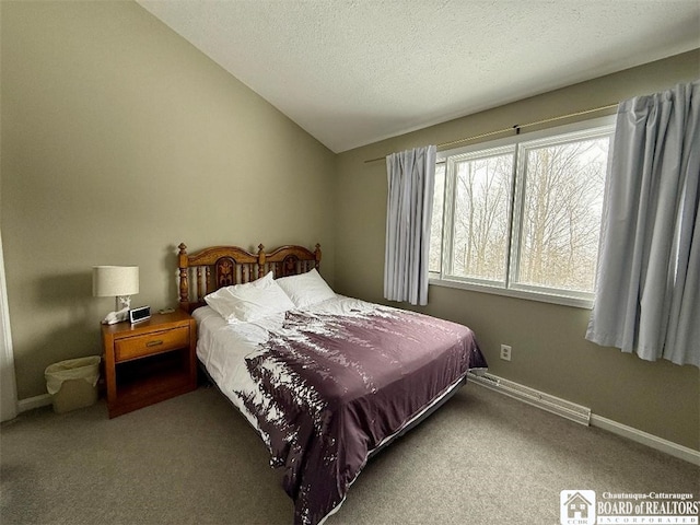 carpeted bedroom featuring vaulted ceiling, a textured ceiling, and baseboards