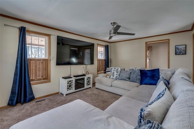 living area with a wealth of natural light, visible vents, crown molding, and light carpet