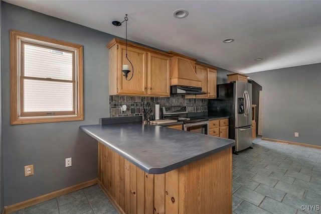 kitchen with stainless steel appliances, a peninsula, ventilation hood, backsplash, and dark countertops