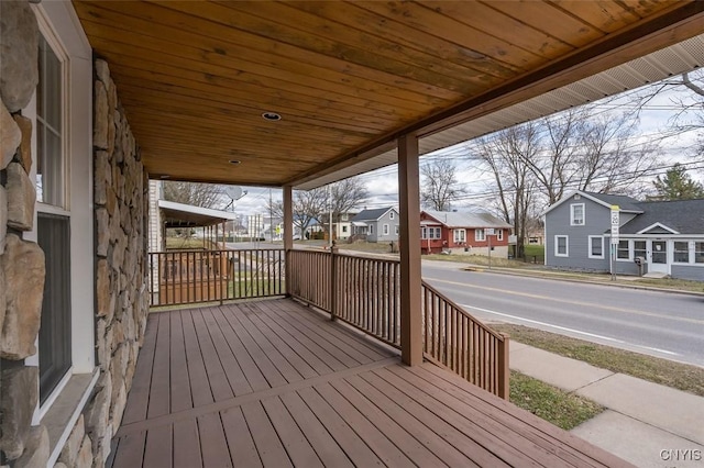 wooden terrace with a residential view